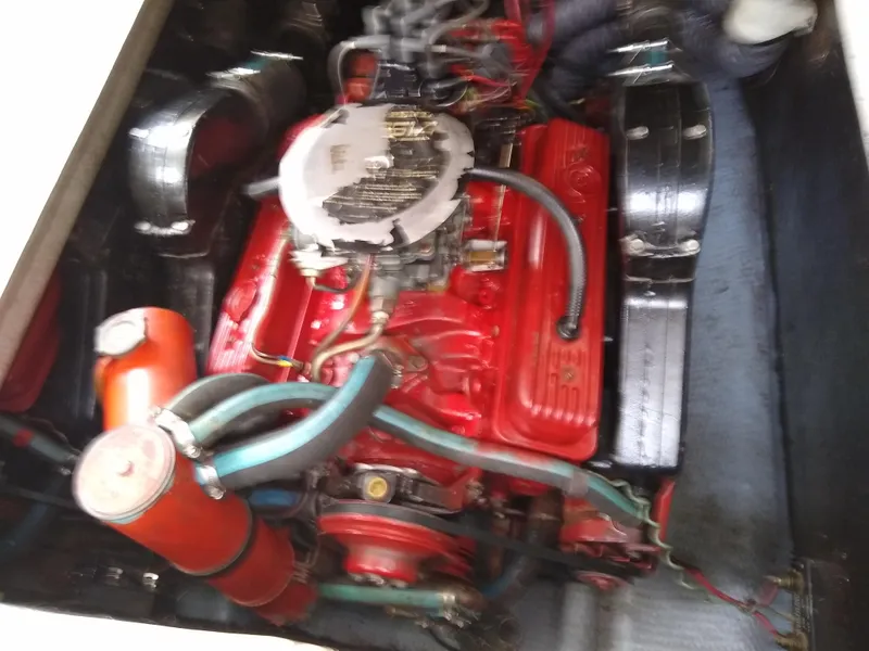 Slide: The Image of 1988 Albemarle 27 Express Fisherman engine, featuring a red-painted motor with visible hoses and components. - 26