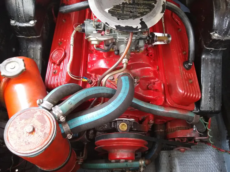 Slide: The Image of Engine of 1988 Albemarle 27 Express Fisherman with red components and hoses. - 27