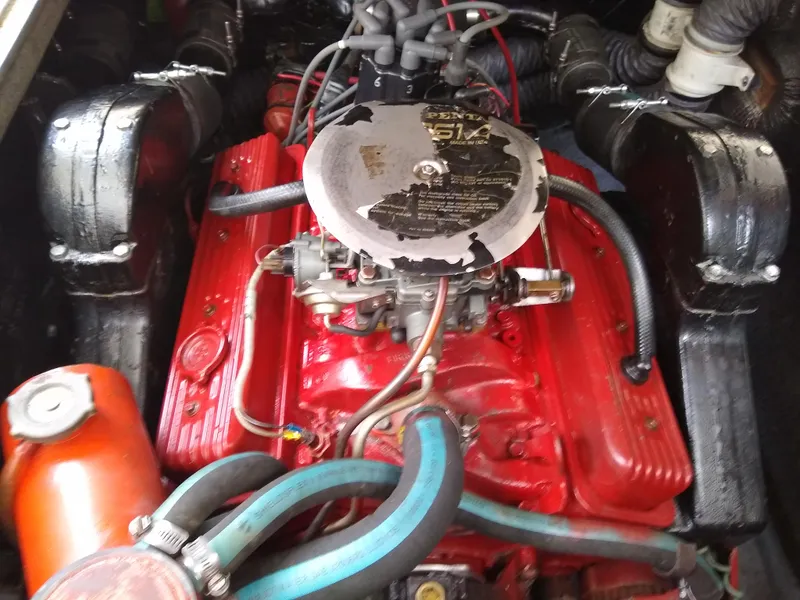 Slide: The Image of 1988 Albemarle 27 Express Fisherman engine, red with visible hoses and components. - 28