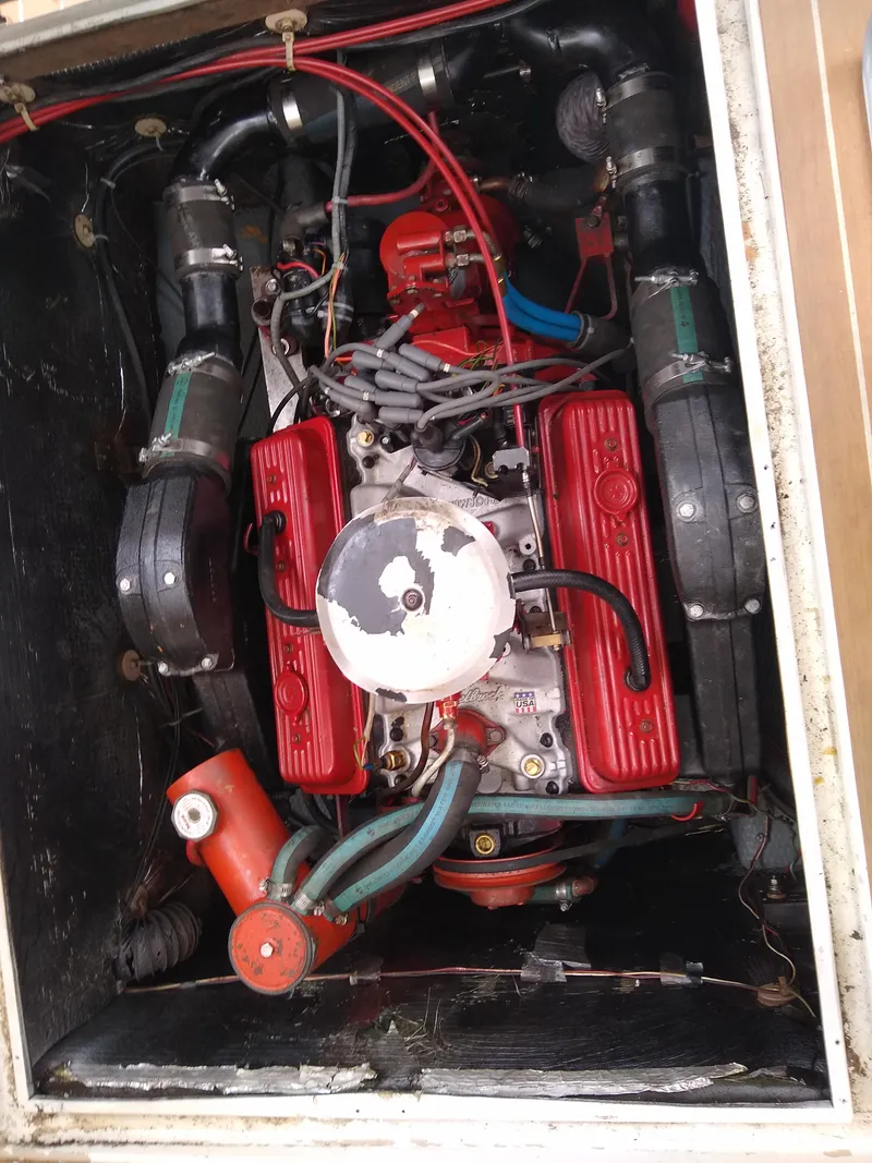 Slide: The Image of Engine of 1988 Albemarle 27 Express Fisherman with red components and visible wiring. - 29