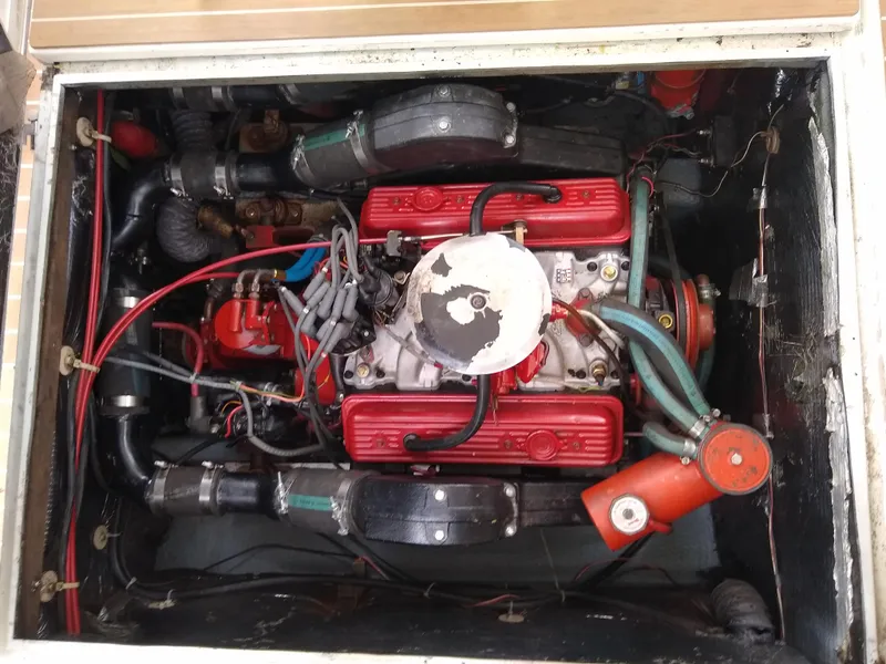 Slide: The Image of Engine compartment of a 1988 Albemarle 27 Express Fisherman boat, featuring red valve covers. - 31