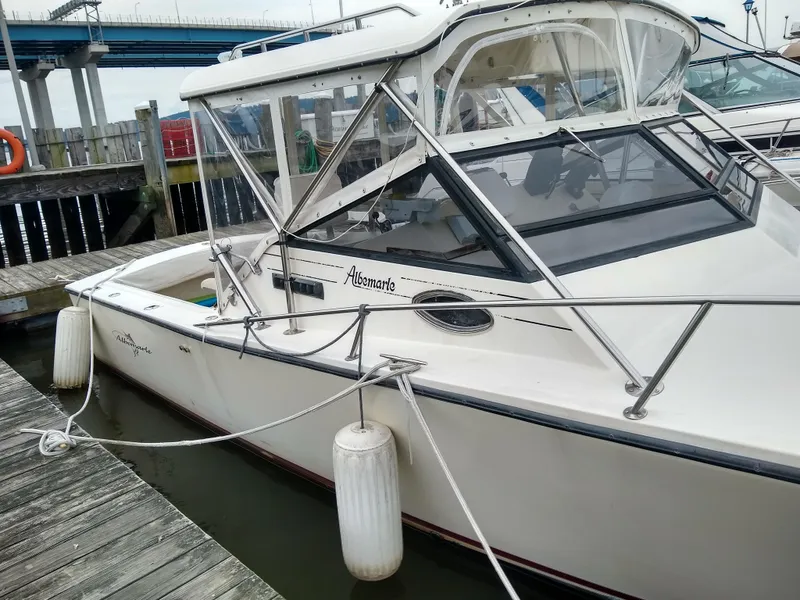 Slide: The Image of 1988 Albemarle 27 Express Fisherman boat docked at marina with protective fenders. - 33