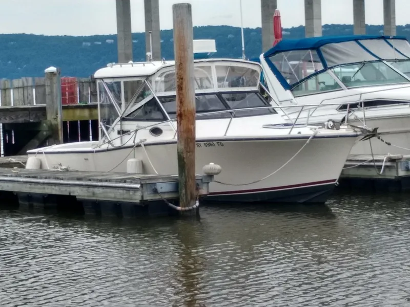 Slide: The Image of 1988 Albemarle 27 Express Fisherman boat docked at marina, calm water, overcast sky. - 41