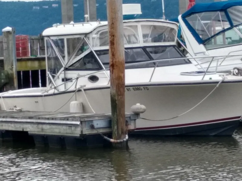 Slide: The Image of 1988 Albemarle 27 Express Fisherman boat docked at marina. - 42
