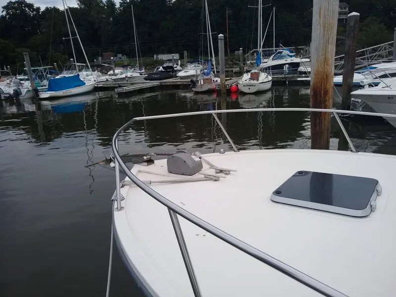 Slide: The Image of 1988 Albemarle 27 Express Fisherman docked in a marina with other boats. - 5