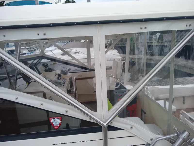 Slide: The Image of 1988 Albemarle 27 Express Fisherman boat interior with visible controls and seating. - 7