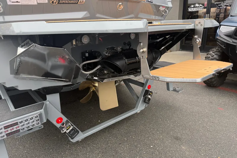 Slide: The Image of 2026 MasterCraft X24 boat stern with propeller and swim platform. - 12