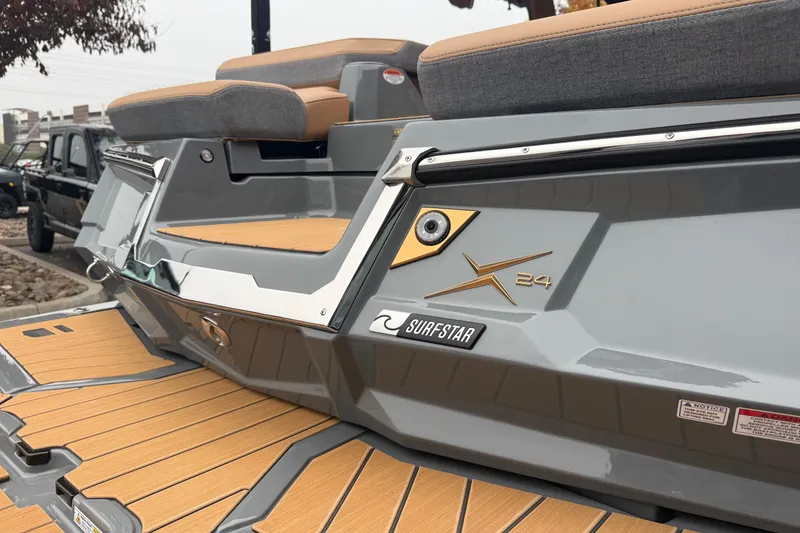 Slide: The Image of 2026 MasterCraft X24 boat with SurfStar feature, showcasing sleek design and comfortable seating. - 14