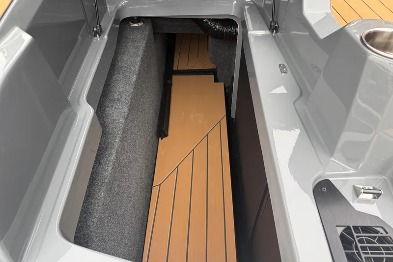 Slide: The Image of Interior view of 2026 MasterCraft X24 boat storage compartment with sleek design. - 23