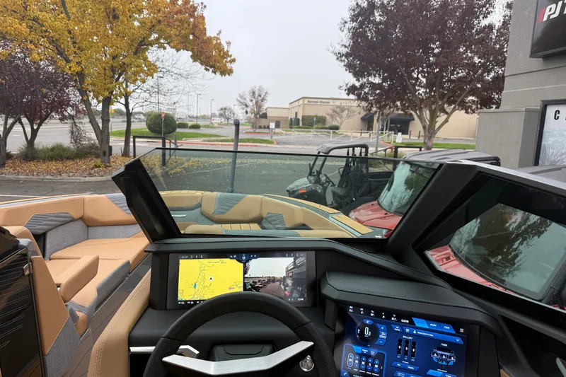 Slide: The Image of 2026 MasterCraft X24 boat interior with advanced dashboard and navigation screens. - 26