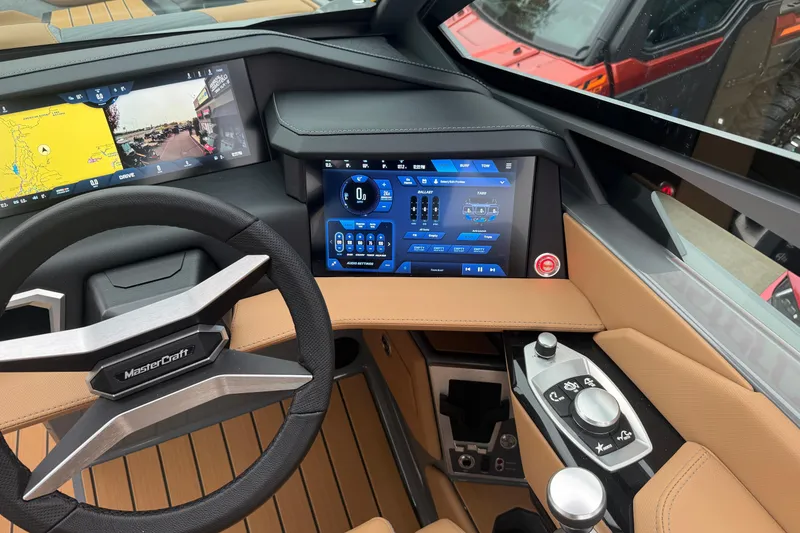 Slide: The Image of 2026 MasterCraft X24 dashboard with advanced touchscreen controls and navigation system. - 31