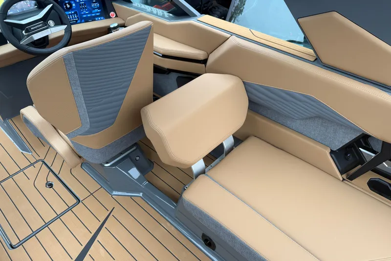 Slide: The Image of 2026 MasterCraft X24 interior with tan and gray seating, modern dashboard, and sleek design. - 37