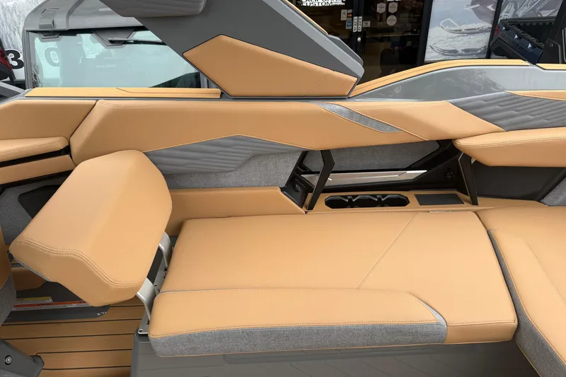 Slide: The Image of 2026 MasterCraft X24 boat interior with tan and gray upholstery, featuring sleek, modern design. - 38