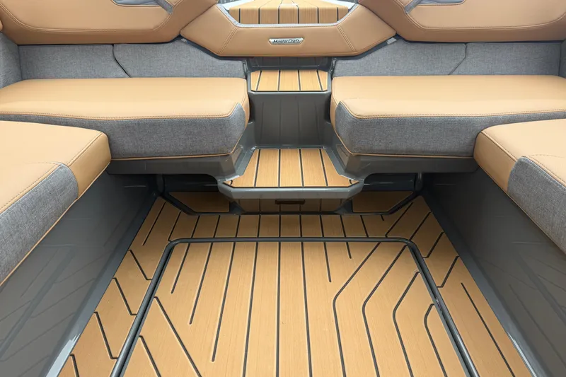 Slide: The Image of 2026 MasterCraft X24 interior with tan and gray seating, stylish flooring. - 45