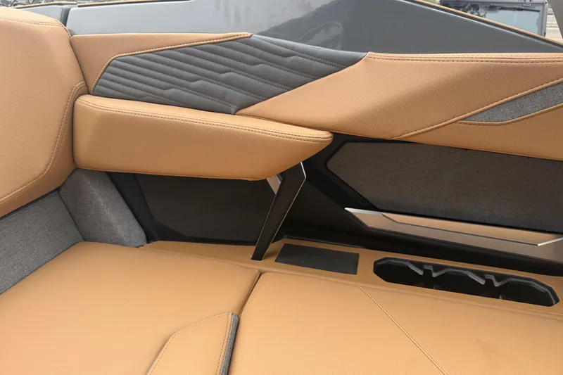 Slide: The Image of 2026 MasterCraft X24 interior with tan and black upholstery, featuring sleek modern design. - 47