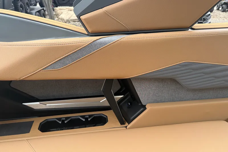 Slide: The Image of 2026 MasterCraft X24 interior detail with tan and gray upholstery design. - 48