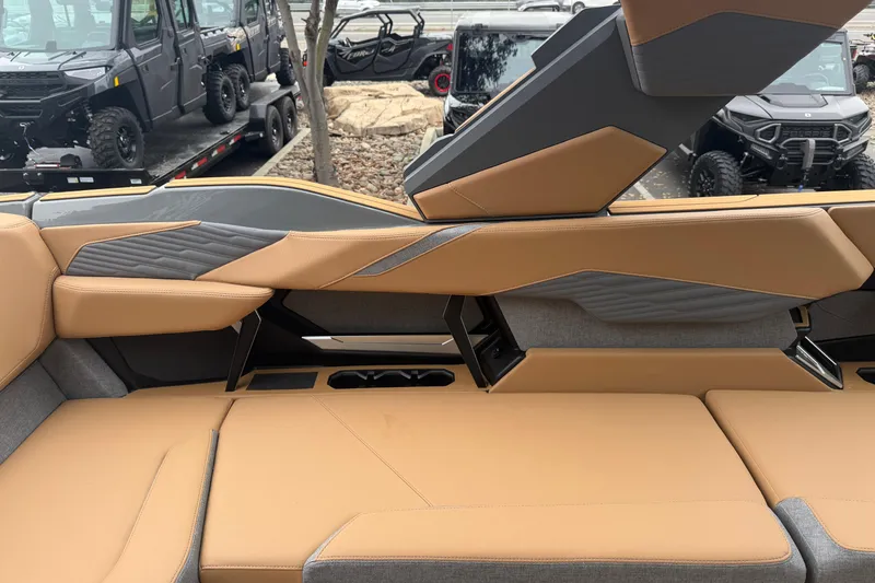 Slide: The Image of 2026 MasterCraft X24 boat interior with tan and gray seating, showcasing modern design. - 49
