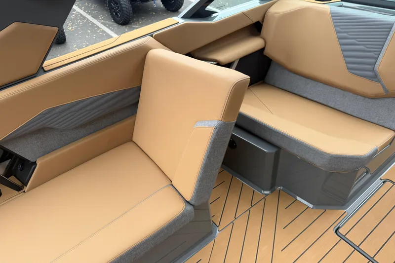 Slide: The Image of 2026 MasterCraft X24 boat interior with tan and gray seating, modern design. - 51