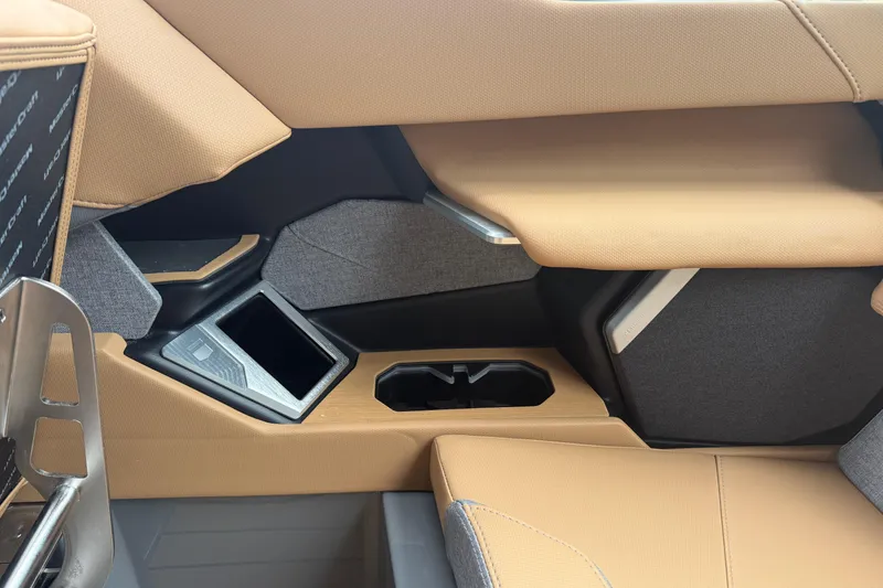 Slide: The Image of 2026 MasterCraft X24 interior with tan upholstery and modern design elements. - 53