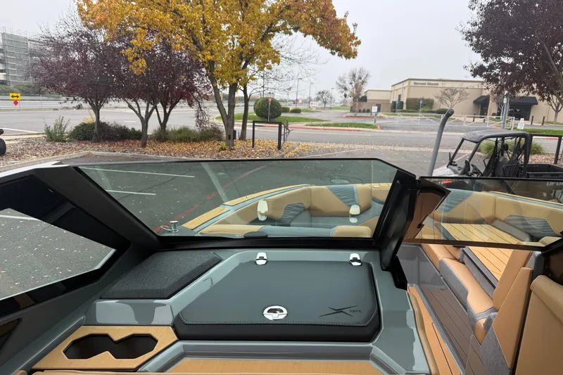 Slide: The Image of 2026 MasterCraft X24 boat interior with sleek design and comfortable seating. - 55