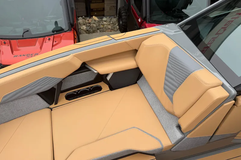 Slide: The Image of Luxurious tan and gray seating in 2026 MasterCraft X24 boat interior. - 67