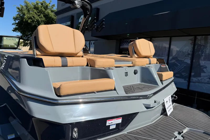 Slide: The Image of 2026 MasterCraft XT24 boat with tan seating and sleek design. - 13