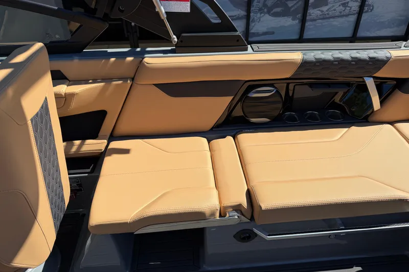 Slide: The Image of Luxurious tan seating in 2026 MasterCraft XT24 boat interior. - 19