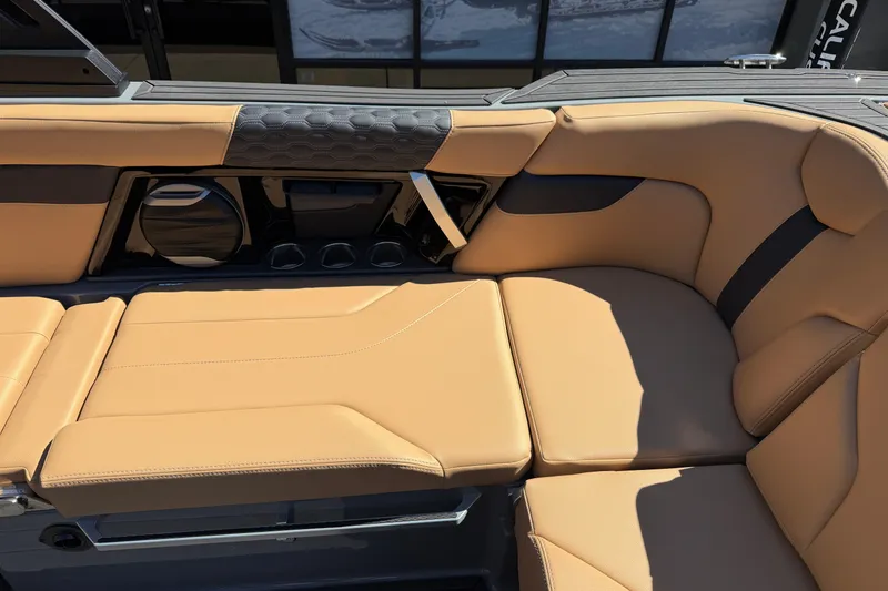 Slide: The Image of 2026 MasterCraft XT24 boat interior with tan leather seating and modern design. - 20