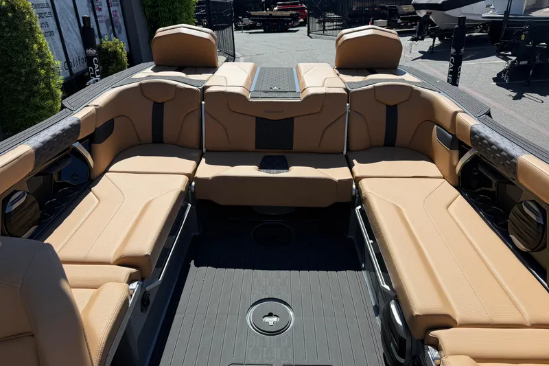 Slide: The Image of Luxurious interior of 2026 MasterCraft XT24 boat with tan seating and sleek design. - 22