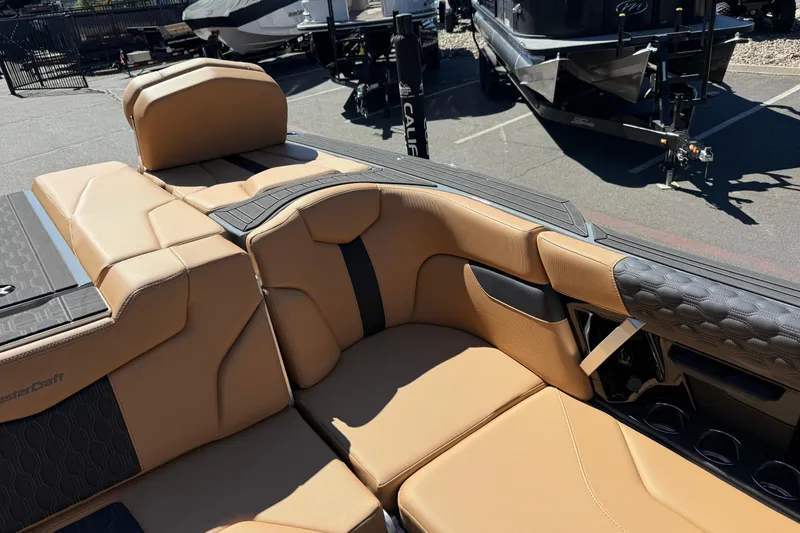 Slide: The Image of Luxurious interior of a 2026 MasterCraft XT24 boat with tan leather seating. - 23