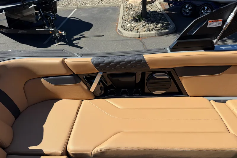 Slide: The Image of 2026 MasterCraft XT24 boat interior with tan leather seating and modern design elements. - 24