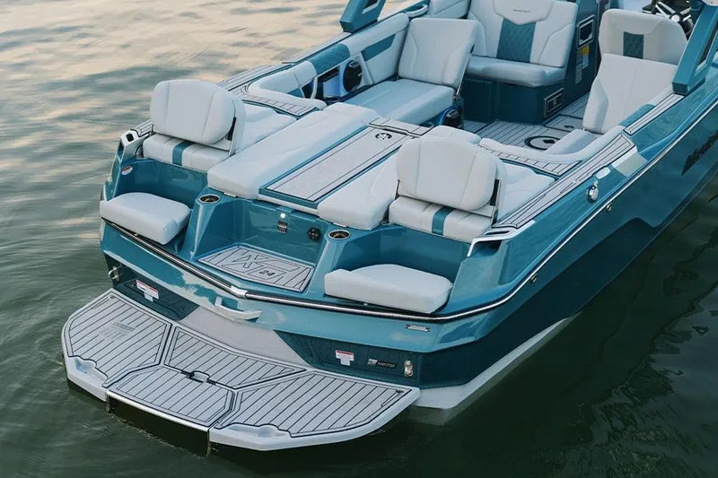Slide: The Image of Manufacturer Provided Image: 2026 MasterCraft XT24 boat with luxurious seating and sleek design on the water. - 8