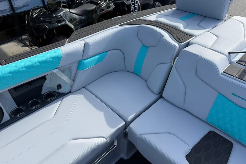 Slide: The Image of Luxurious interior of 2026 MasterCraft XT23 boat with stylish blue and white seating. - 17