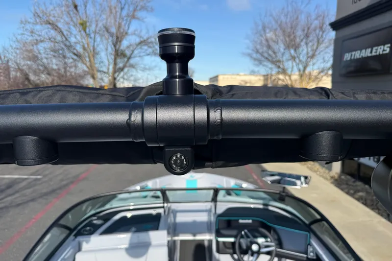 Slide: The Image of 2026 MasterCraft XT23 boat interior with steering wheel and mounted camera. - 31