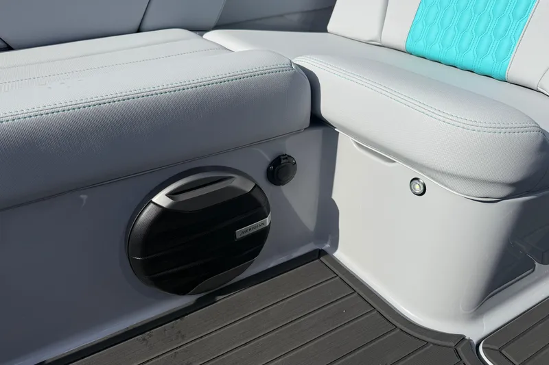 Slide: The Image of 2026 MasterCraft XT23 boat interior with speaker and cushioned seating. - 35
