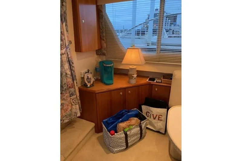 Slide: The Image of Interior of 1999 Silverton 351 Sedan with lamp, bags, and decor. - 15