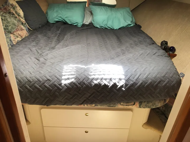 Slide: The Image of Interior of a 1999 Silverton 351 Sedan with cozy bed. - 18