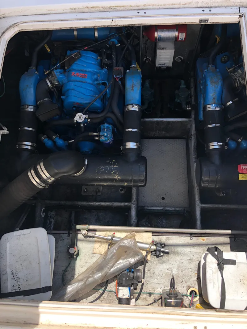Slide: The Image of Engine compartment of a 1999 Silverton 351 Sedan with blue engines. - 20