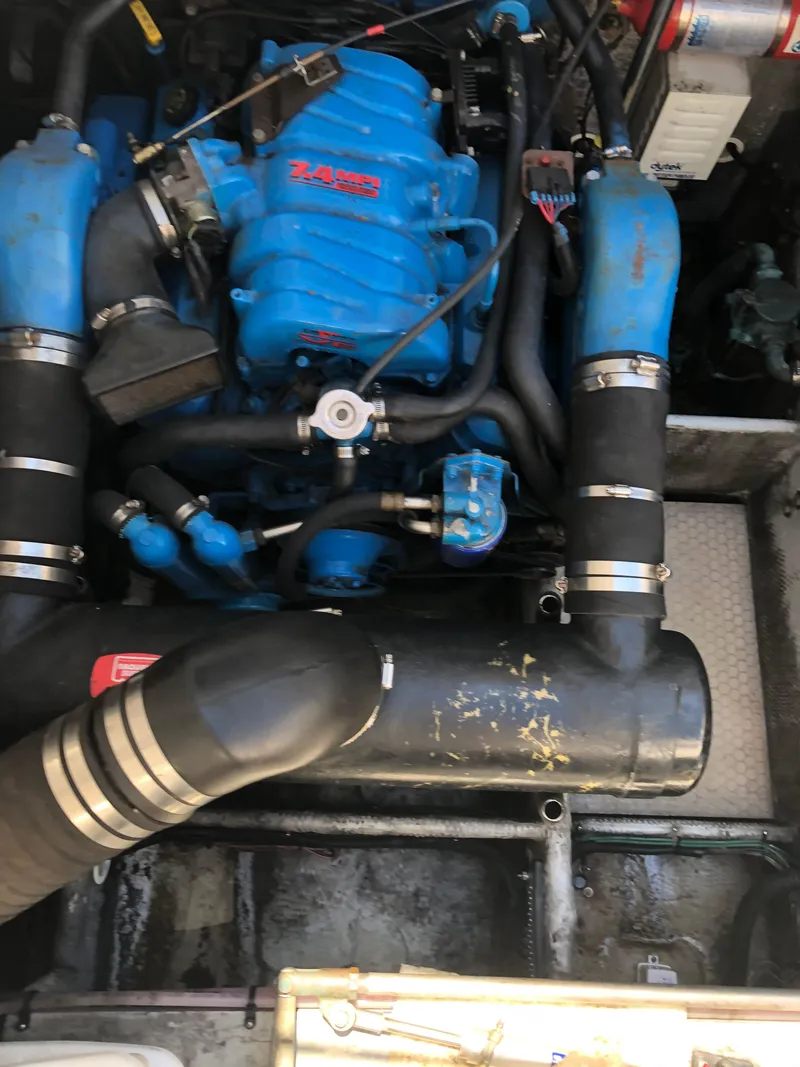 Slide: The Image of Engine compartment of a 1999 Silverton 351 Sedan with blue engine. - 21