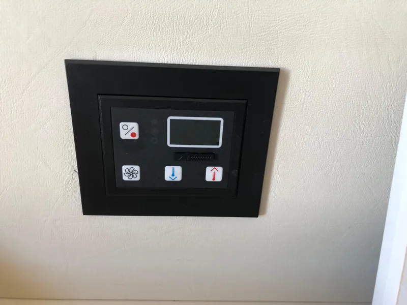 Slide: The Image of Control panel in 1999 Silverton 351 Sedan, wall-mounted. - 24