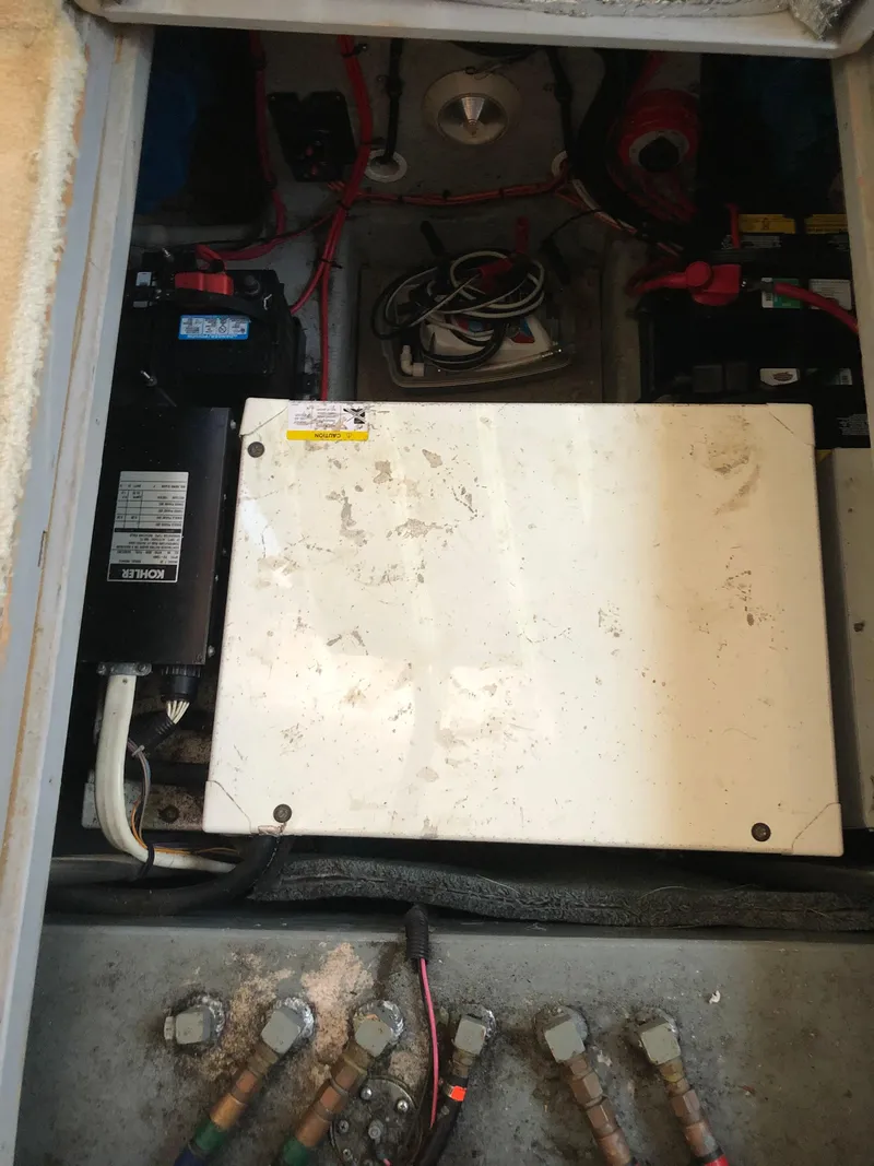 Slide: The Image of Engine compartment of 1999 Silverton 351 Sedan with batteries and wiring. - 25