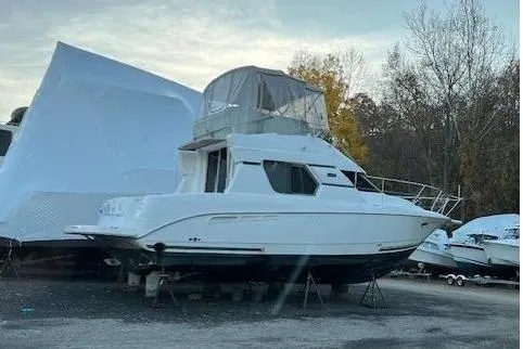 Slide: The Image of 1999 Silverton 351 Sedan yacht in dry dock, side view. - 5