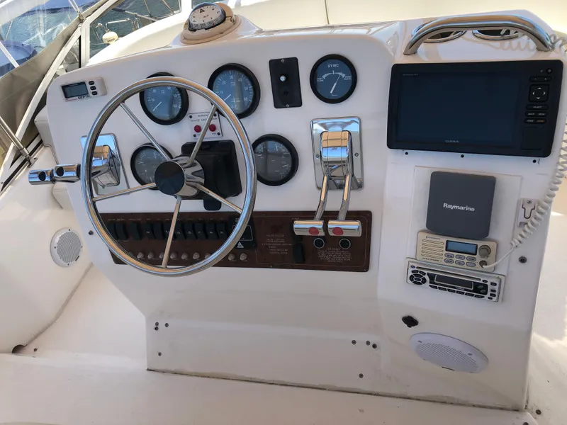 Slide: The Image of Dashboard of a 1999 Silverton 351 Sedan with steering wheel and instruments. - 6