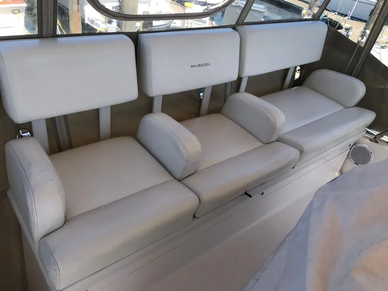 Slide: The Image of Interior of 1999 Silverton 351 Sedan with white leather seating. - 8