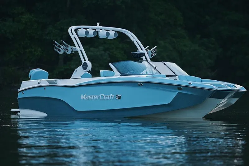 Slide: The Image of Manufacturer Provided Image: 2026 MasterCraft XT22 boat on calm water, featuring sleek design and modern features. - 3