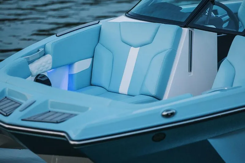Slide: The Image of Manufacturer Provided Image: 2026 MasterCraft XT22 boat interior with blue and white seating, illuminated accents. - 4