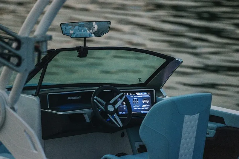 Slide: The Image of Manufacturer Provided Image: 2026 MasterCraft XT22 boat interior with modern dashboard and steering wheel. - 6