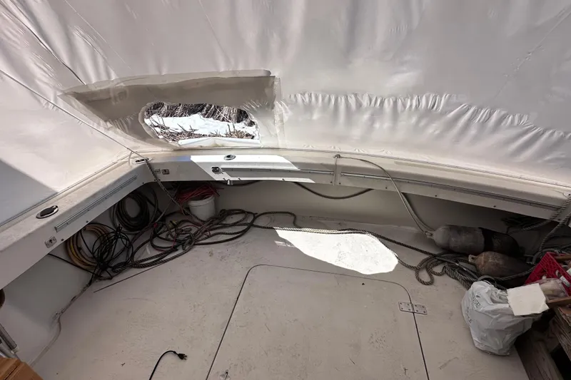 Slide: The Image of 1988 Silverton 37 Convertible boat interior with ropes and equipment. - 12