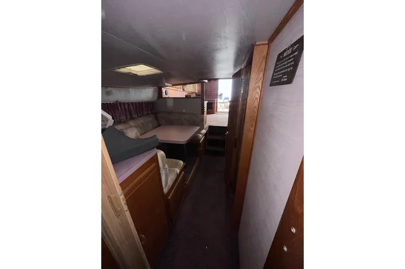 Slide: The Image of Interior of 1988 Silverton 37 Convertible yacht with cozy seating and dining area. - 33
