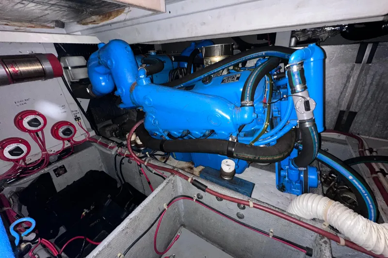 Slide: The Image of Engine room of 1988 Silverton 37 Convertible with blue machinery and wiring. - 35